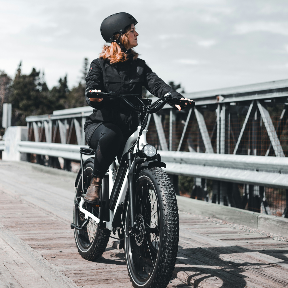 Himiway Cruiser with rider on a bridge looking to the right