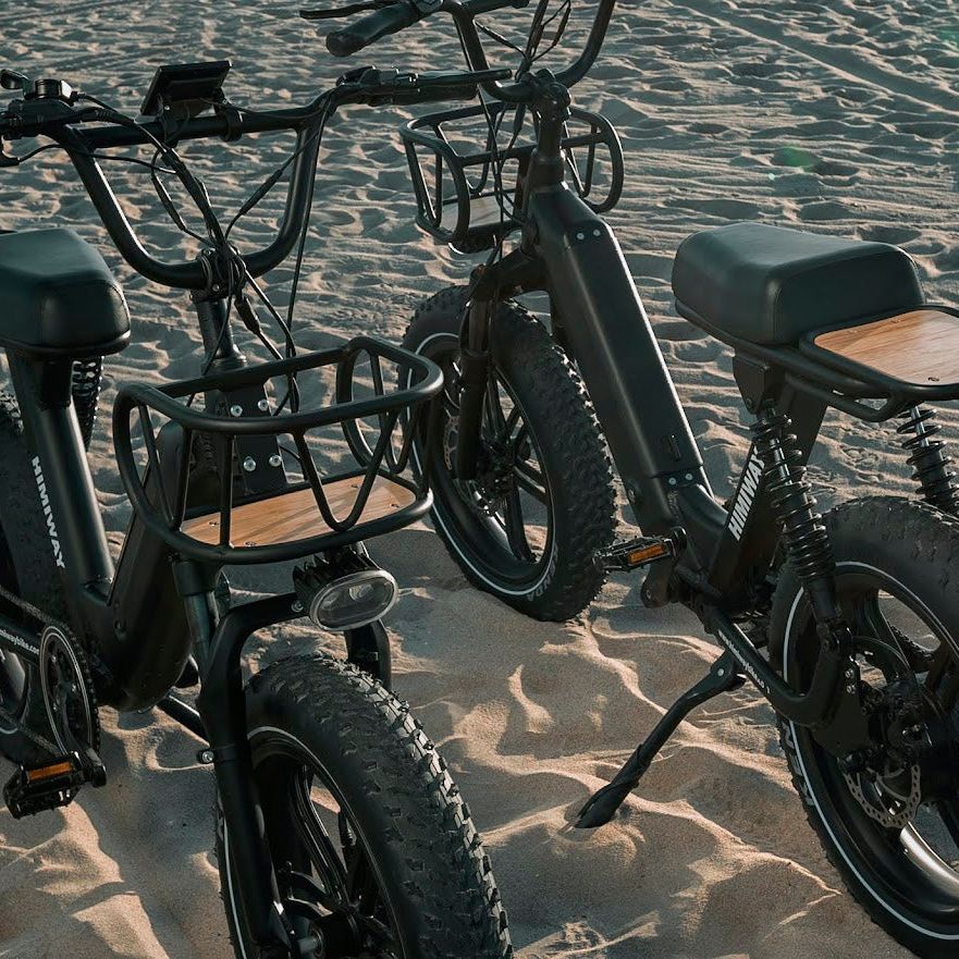 Himiway Escape Pro. Moped-Style Long Range Electric Bike Two Escape Pro Bikes Together On The Beach