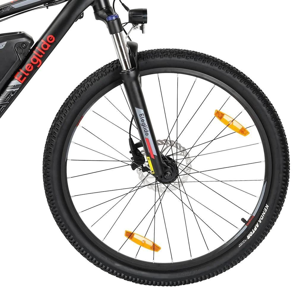 Eleglide M2 29" Electric Mountain Bike, 15.5MPH close up of the front wheel in a white studio setting 