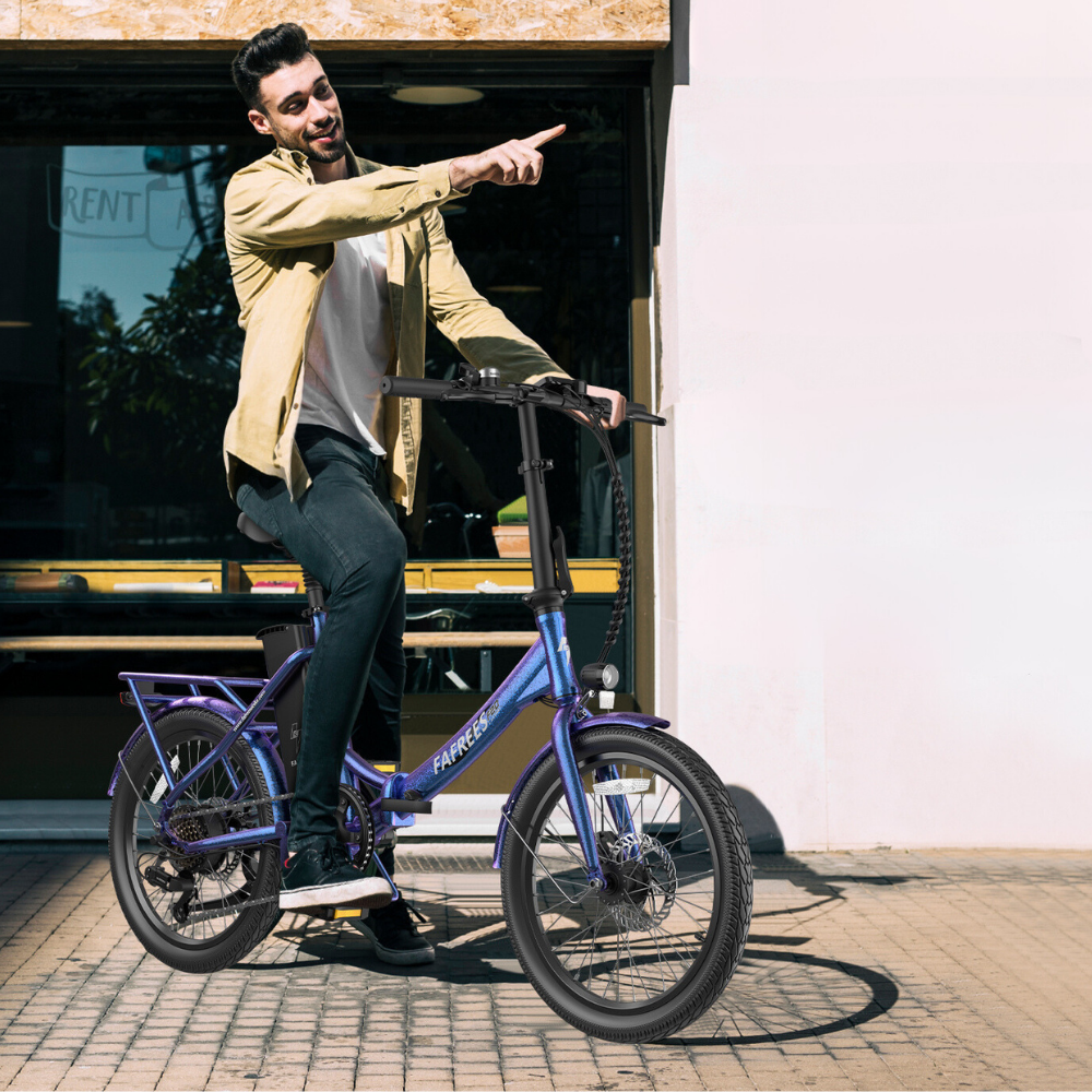 Man on a bike pointing to the far distance while sitting on a Fafrees electric bike