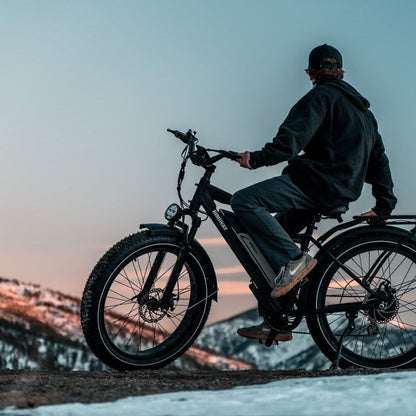 Himiway Cruiser All Terrain Fat Tyre Long Range Electric Bike Black On A Snow Topped Mountain