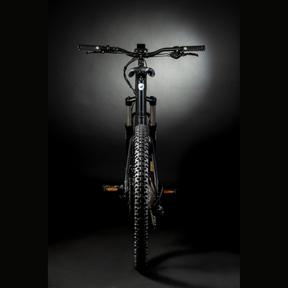 MBM Kairos 27.5" Electric Mountain Bike, Mid Drive 15.5MPH From Behind Dark Background 