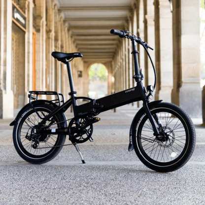 Legend MONZA Folding Electric Bike, 15.5MPH, black in a city setting