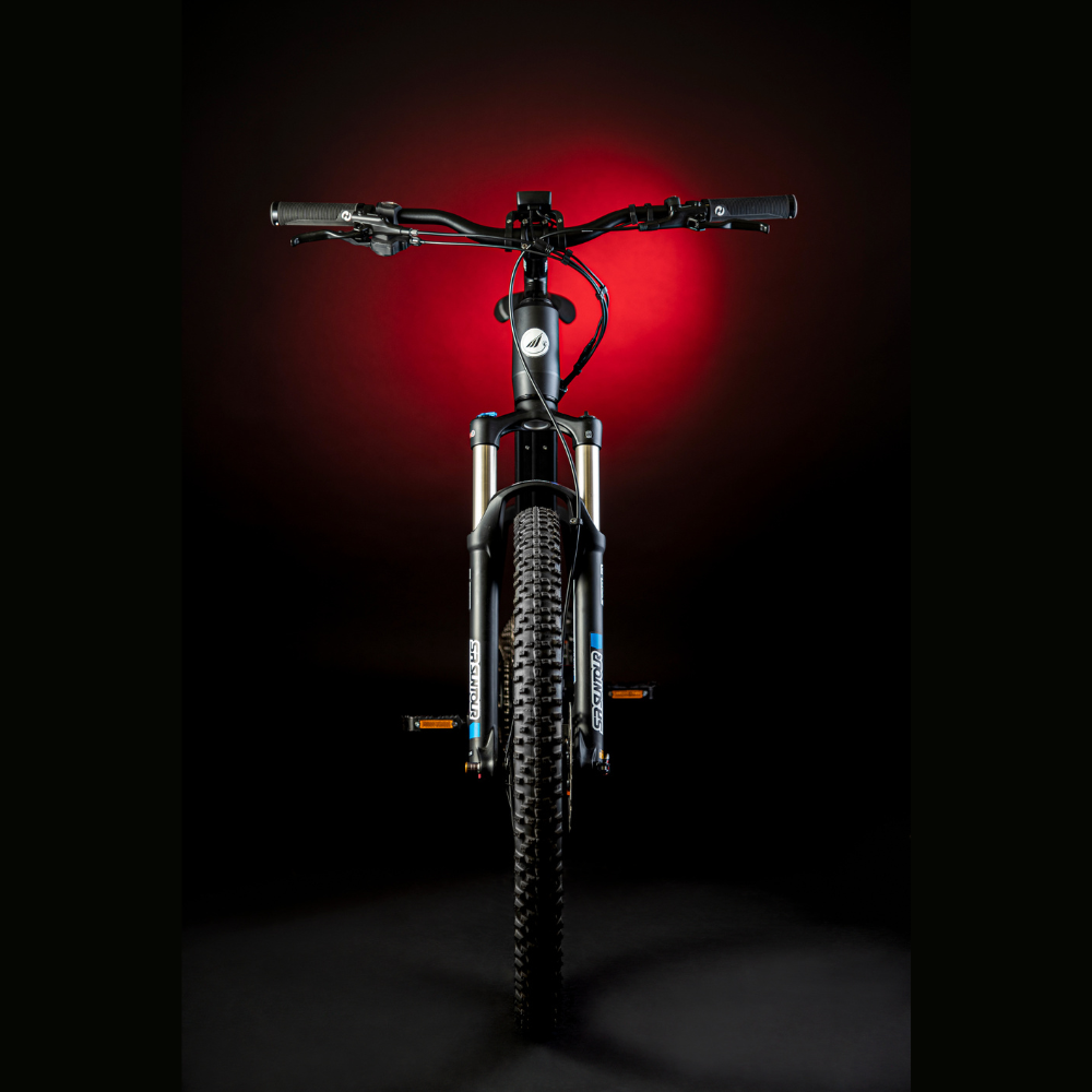 MBM Kairos 29" Electric Mountain Bike, Mid Drive 15.5MPH Head On Red Highlight Dark Background