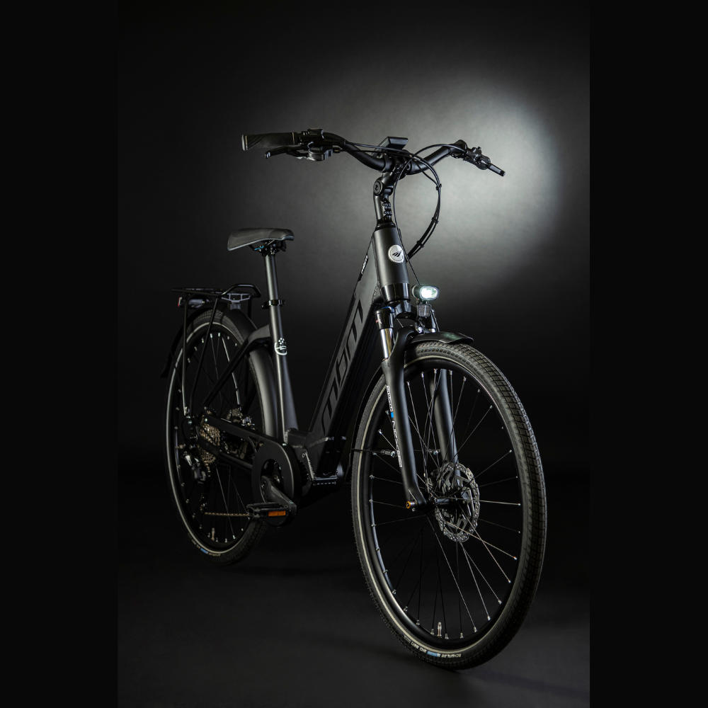 MBM Sinope Step Thru Urban Electric Bike, 15.5MPH Facing oblique right in a dark studio with white highlighting