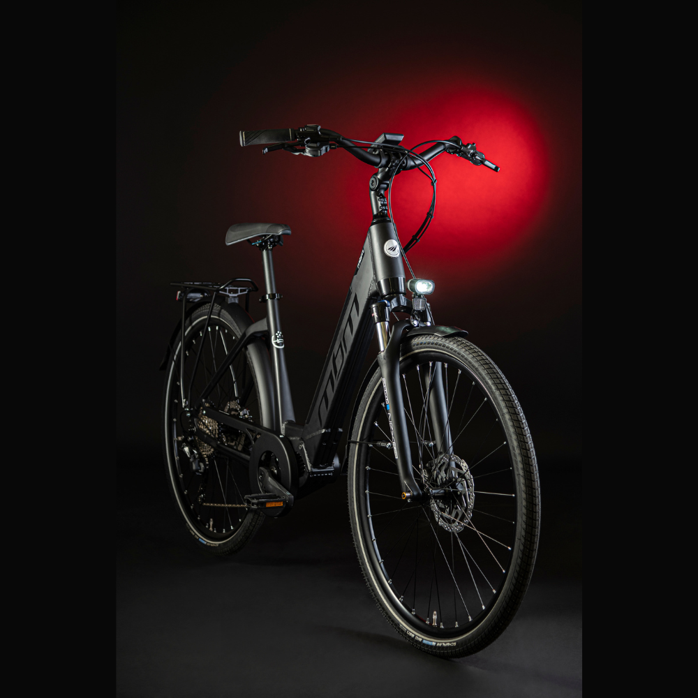 MBM Sinope Step Thru Urban Electric Bike, 15.5MPH Studio shot dark background with red highlighting. Facing oblique right 