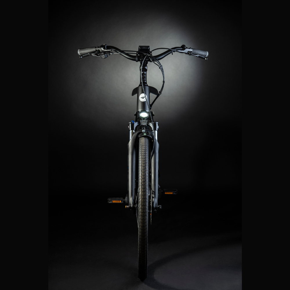 MBM Sinope Step Thru Urban Electric Bike, 15.5MPH From the front of the bike in a dark studio with white high lighting