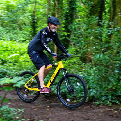 Mark2 Scrambler C Electric Mountain Bike, 90Nm Mid Drive, Top Speed 15.5MPH Yellow Riding In Woods 