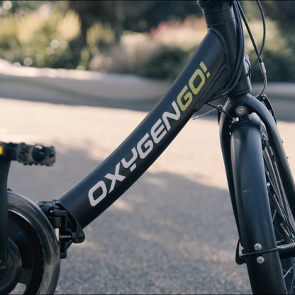 Oxygen Go Folding Step Thru Electric Bike, Urban, Black 15.5MPH close up of the frame and logo 