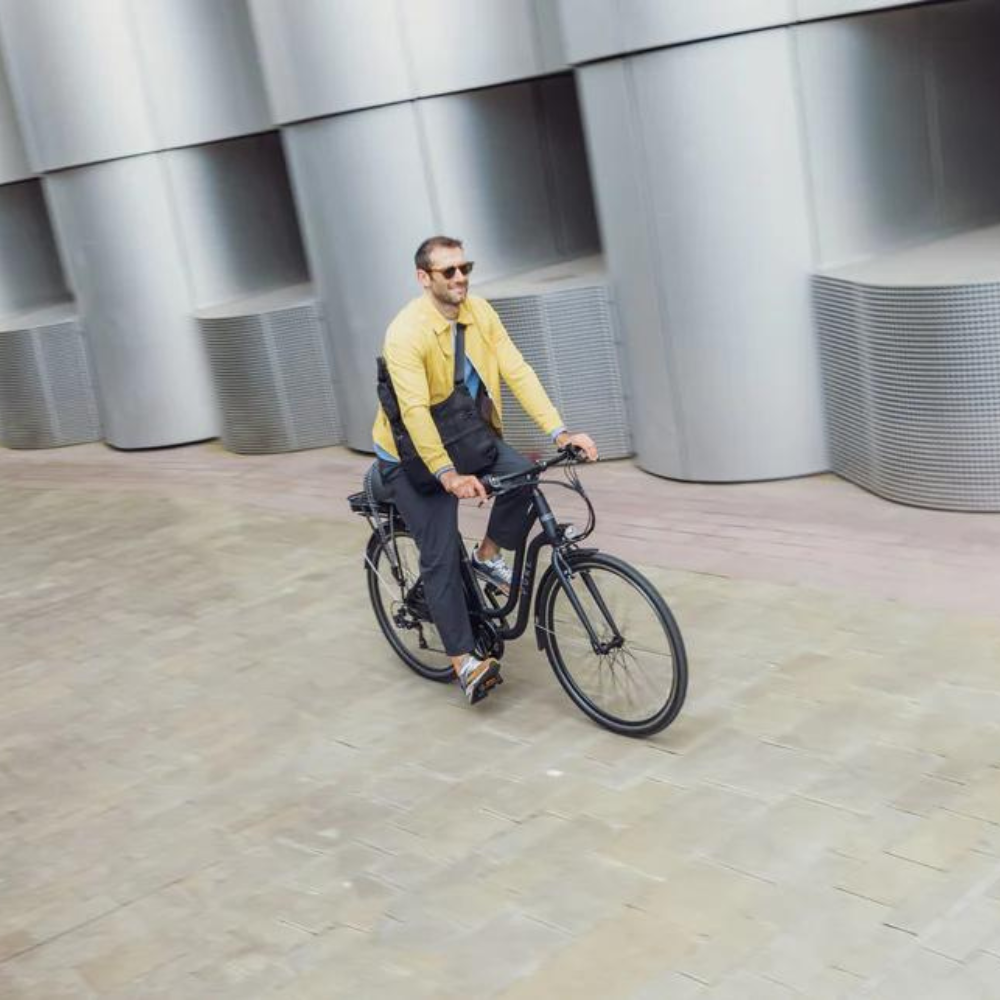 PURE Free City Step Thru Electric Bike, 15.5MPH being ridden in a town 